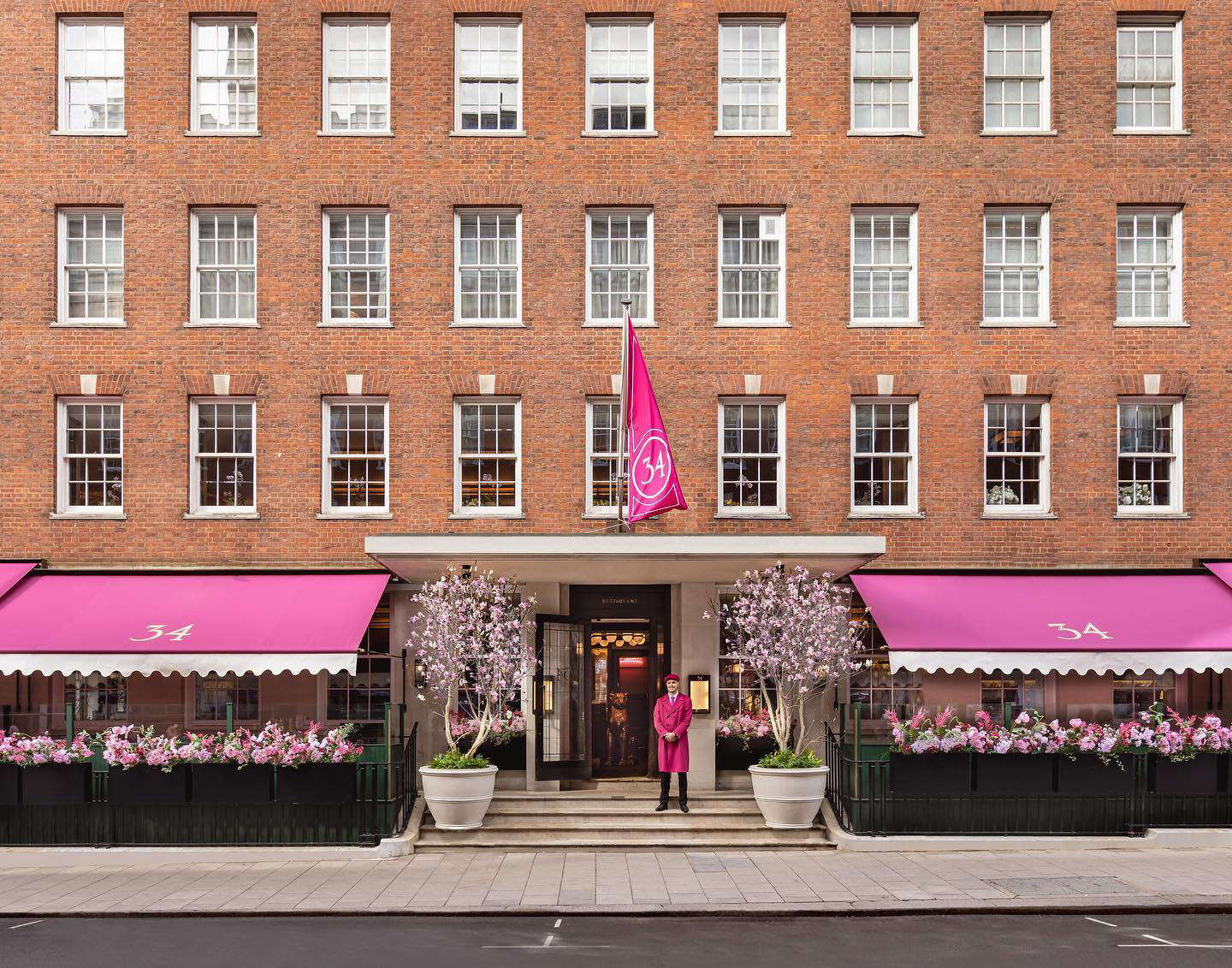 Wander through Grosvenor Square this Spring to find our rosy pink awning atop a ravishing terrace di